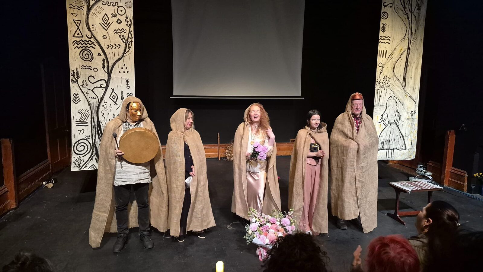 The full company takes its curtain call on the La Mama Courthouse stage before a full house.